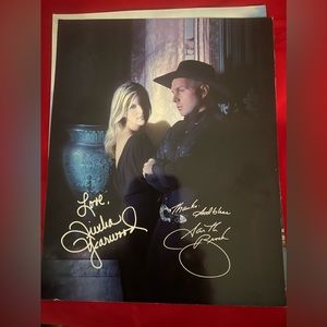 2 8x 10 signed photos of Garth Brooks and Julia Yearwood .
